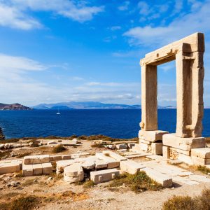 Naxos Portara or Apollo Temple entrance gate on Palatia island near Naxos island in Greece